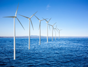 A group of wind turbines in the water Description automatically generated with medium confidence