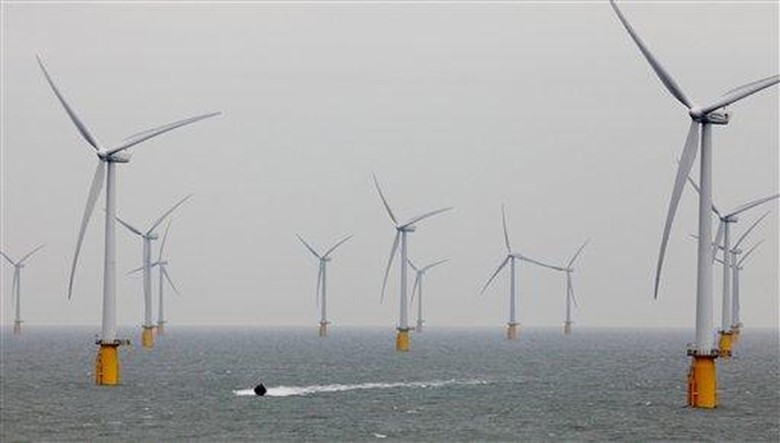 A group of wind turbines in a body of water Description automatically generated with medium confidence